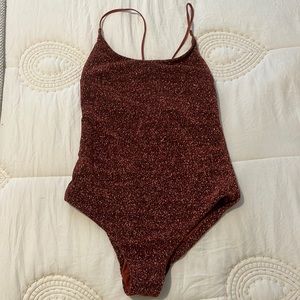 Metallic orange swimsuit/body suit